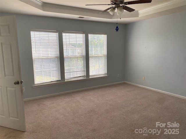 10901 Claude Freeman Dr, Charlotte, NC 28262 - carpeted spare room with crown molding, a raised ceiling, ceiling fan, and baseboards