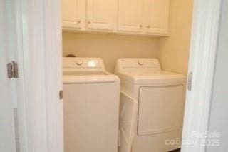 10901 Claude Freeman Dr, Charlotte, NC 28262 - washroom featuring washing machine and clothes dryer and cabinet space