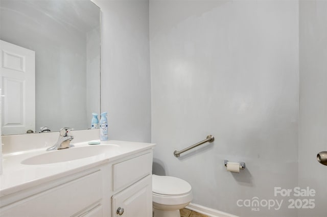 10901 Claude Freeman Dr, Charlotte, NC 28262 - half bathroom featuring vanity and toilet