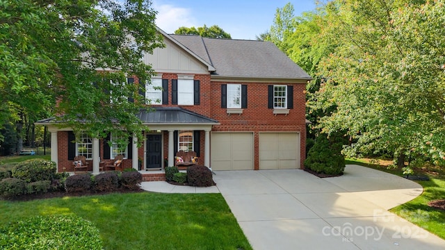 1108 Longwood Ct, Matthews, NC 28104 - view of front facade with brick siding, a garage, driveway, a porch, and a front yard