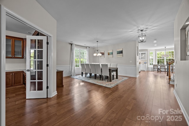 1108 Longwood Ct, Matthews, NC 28104 - corridor featuring a chandelier, healthy amount of natural light, dark wood-style flooring, and baseboards