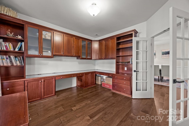 1108 Longwood Ct, Matthews, NC 28104 - unfurnished office featuring built in desk, french doors, and dark wood-style flooring
