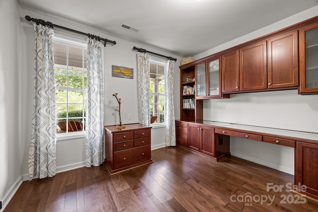 1108 Longwood Ct, Matthews, NC 28104 - unfurnished office with built in desk, plenty of natural light, and dark wood finished floors