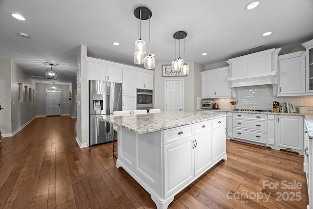 1108 Longwood Ct, Matthews, NC 28104 - kitchen featuring stainless steel fridge with ice dispenser, a center island, white cabinetry, baseboards, and recessed lighting