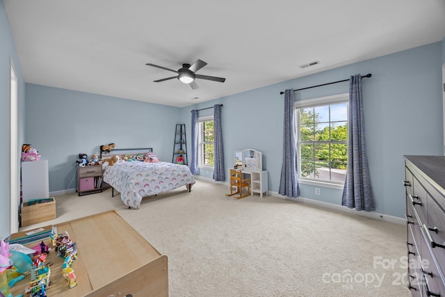 1108 Longwood Ct, Matthews, NC 28104 - carpeted bedroom featuring multiple windows, baseboards, and a ceiling fan