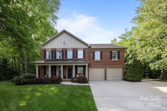 1108 Longwood Ct, Matthews, NC 28104 - view of front of home with concrete driveway, covered porch, a garage, board and batten siding, and brick siding