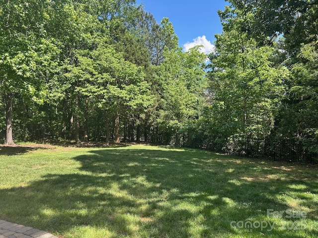 1108 Longwood Ct, Matthews, NC 28104 - view of yard with a wooded view