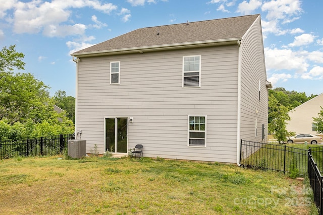 rear view of house with central AC