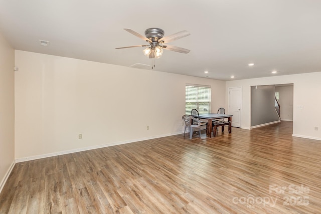 living room with light wood finished floors, recessed lighting, ceiling fan, and baseboards