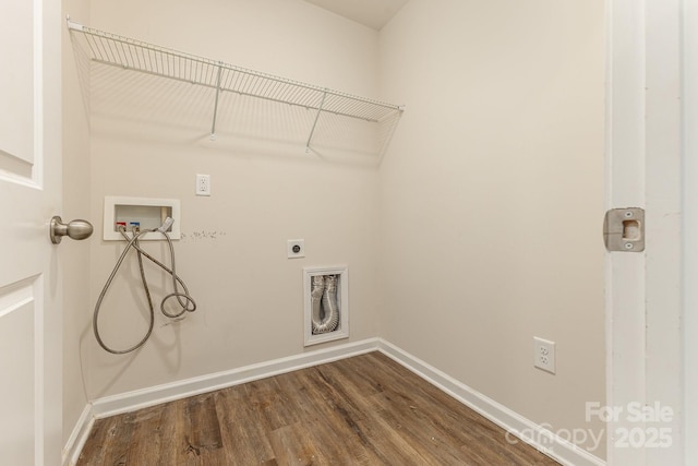 laundry area featuring hookup for a washing machine, electric dryer hookup, baseboards, and dark wood-type flooring