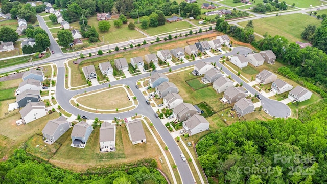 aerial view of property's location with nearby suburban area