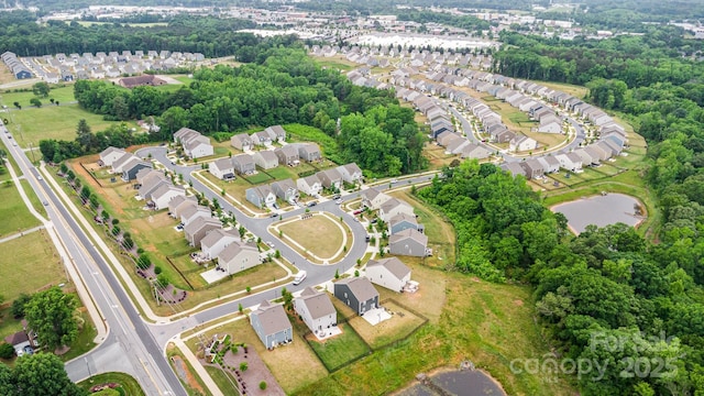 aerial view of property's location with nearby suburban area