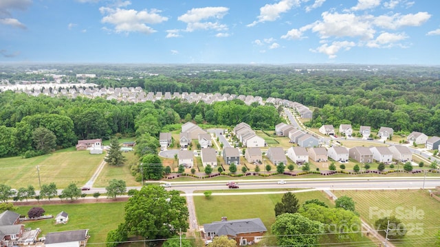 aerial view of residential area with a forest