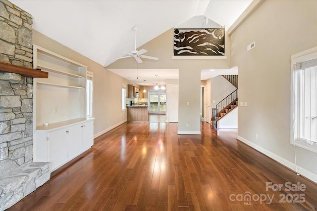 452 Kyfields, Weaverville, NC 28787 - unfurnished living room with a ceiling fan, stairway, high vaulted ceiling, dark wood-type flooring, and baseboards