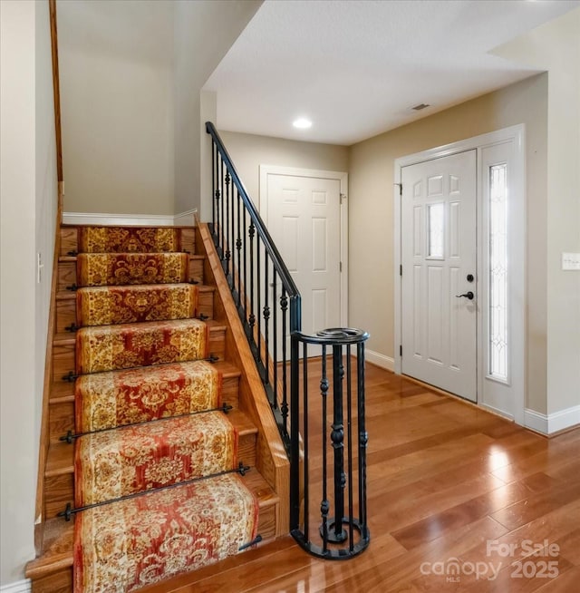 452 Kyfields, Weaverville, NC 28787 - entrance foyer featuring baseboards, stairway, wood finished floors, and recessed lighting