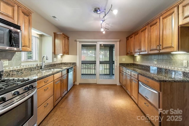 452 Kyfields, Weaverville, NC 28787 - kitchen with appliances with stainless steel finishes, a sink, a warming drawer, and decorative backsplash