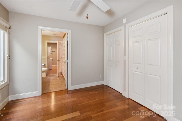 452 Kyfields, Weaverville, NC 28787 - unfurnished bedroom with wood finished floors, baseboards, and a ceiling fan