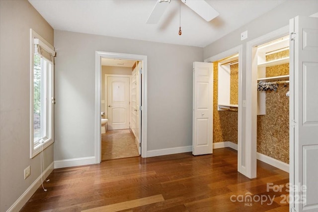 452 Kyfields, Weaverville, NC 28787 - unfurnished bedroom with wood finished floors, baseboards, ensuite bath, and a ceiling fan