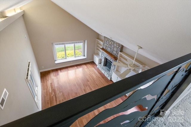 452 Kyfields, Weaverville, NC 28787 - living room with wood finished floors, a stone fireplace, lofted ceiling, and baseboards