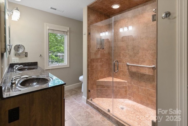 452 Kyfields, Weaverville, NC 28787 - bathroom with tile patterned floors, toilet, a shower stall, baseboards, and double vanity
