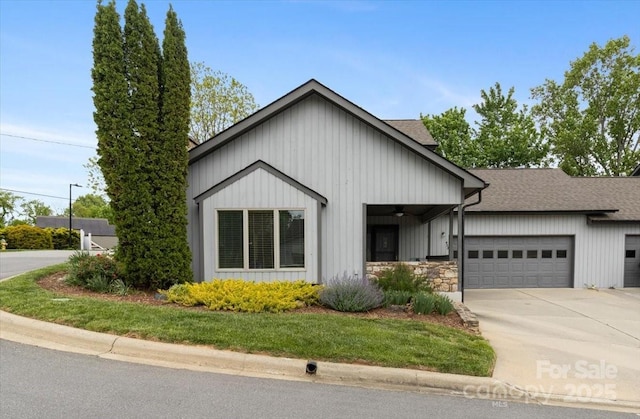452 Kyfields, Weaverville, NC 28787 - view of front of property with a garage, a shingled roof, driveway, board and batten siding, and stone siding