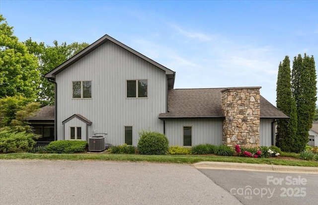 452 Kyfields, Weaverville, NC 28787 - view of property exterior with central air condition unit, a shingled roof, and a chimney