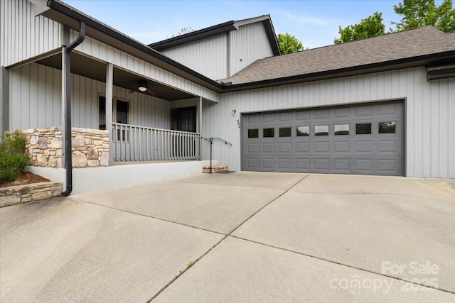 452 Kyfields, Weaverville, NC 28787 - view of side of property with concrete driveway, a garage, a porch, a shingled roof, and stone siding