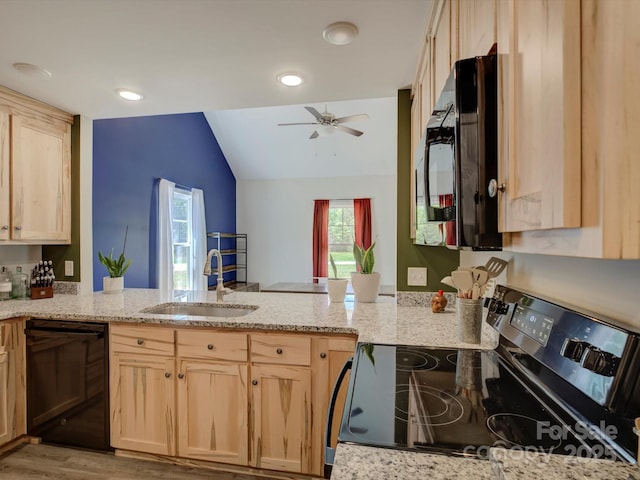 1454 King Rd, York, SC 29745 - kitchen with black appliances, light brown cabinetry, a sink, a peninsula, and lofted ceiling