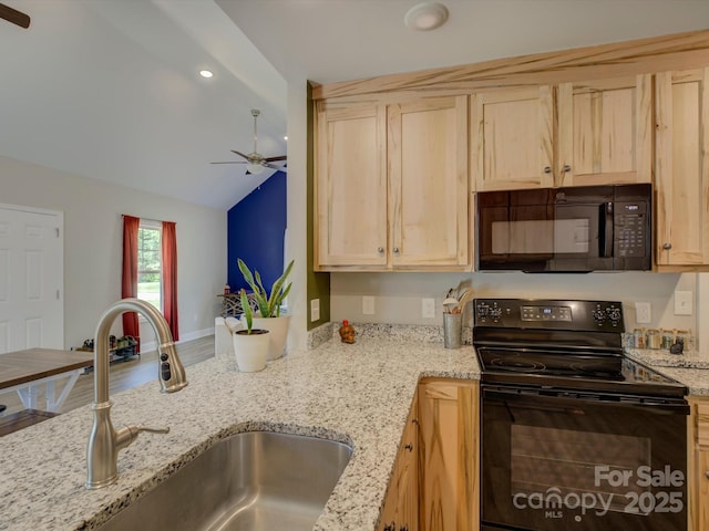 1454 King Rd, York, SC 29745 - kitchen featuring black appliances, a sink, ceiling fan, light brown cabinetry, and vaulted ceiling
