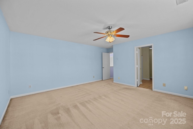 unfurnished bedroom featuring carpet floors, baseboards, and ceiling fan