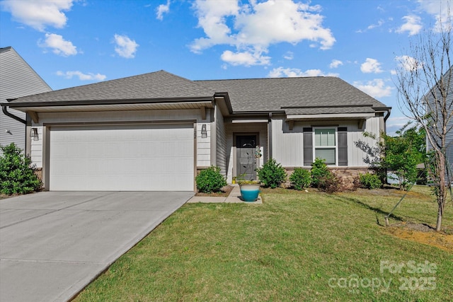 view of front of home with an attached garage, concrete driveway, a front lawn, board and batten siding, and a shingled roof