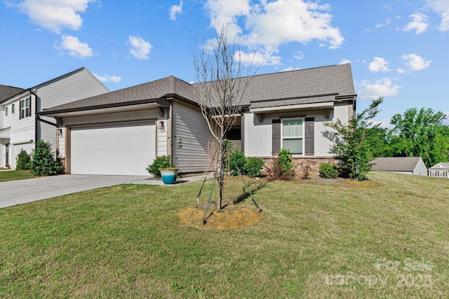 single story home featuring concrete driveway, a front yard, a shingled roof, and an attached garage