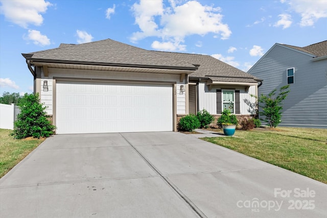 ranch-style house with an attached garage, a shingled roof, a front lawn, and driveway