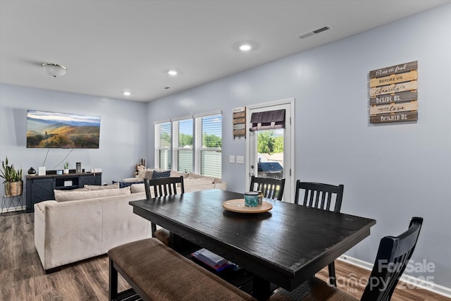 dining room featuring recessed lighting, baseboards, visible vents, and dark wood finished floors