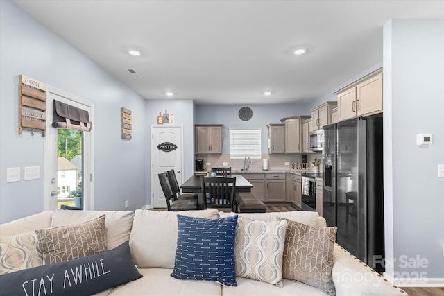 living room with visible vents and recessed lighting