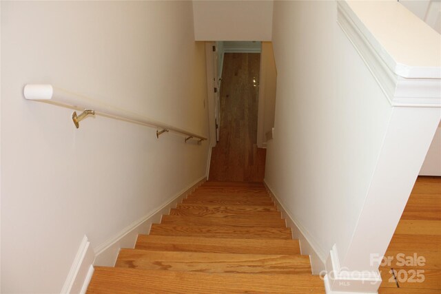 14621 Waterside Dr, Charlotte, NC 28278 - stairs with baseboards and wood finished floors