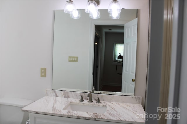 half bathroom with toilet and vanity