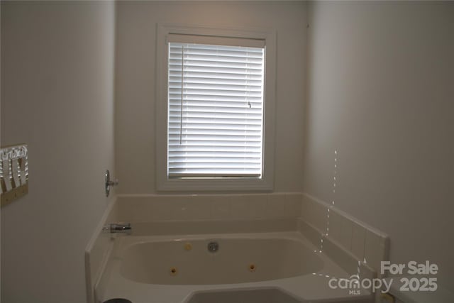 bathroom with a jetted tub