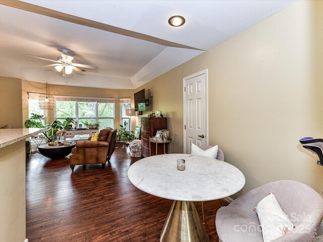 dining room featuring dark wood-type flooring and a ceiling fan