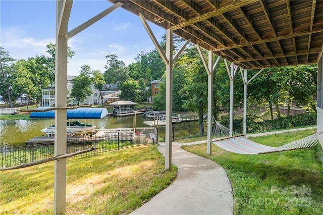 592 Shoreline Rd, New London, NC 28127 - view of home's community with a water view and a dock