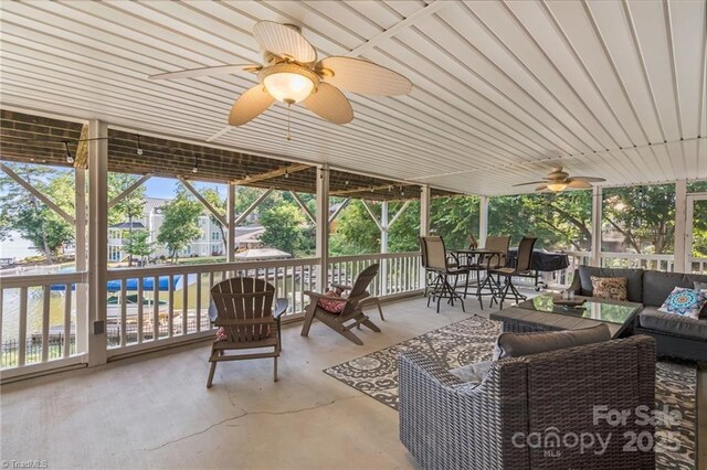 592 Shoreline Rd, New London, NC 28127 - sunroom with an outdoor hangout area, ceiling fan, and plenty of natural light