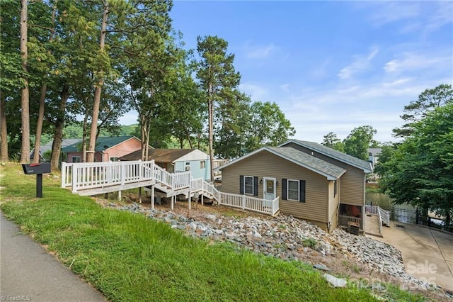 592 Shoreline Rd, New London, NC 28127 - view of front facade with a deck, stairway, and driveway