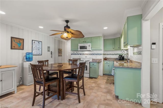 592 Shoreline Rd, New London, NC 28127 - dining area with ornamental molding, a ceiling fan, and recessed lighting