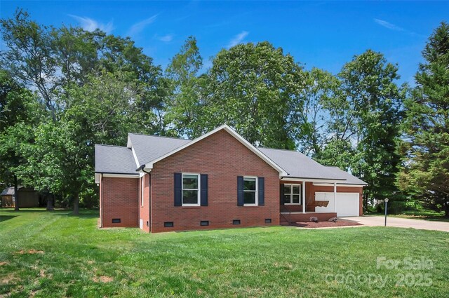 view of front of property with crawl space, an attached garage, concrete driveway, brick siding, and a front yard