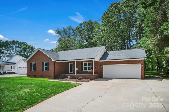 ranch-style house with brick siding, crawl space, a front lawn, and an attached garage