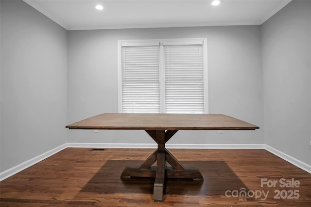unfurnished dining area with baseboards, recessed lighting, and wood finished floors