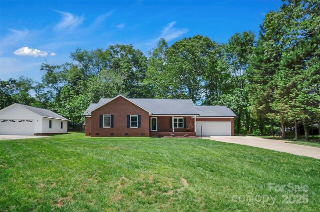 ranch-style home featuring crawl space, a front yard, a garage, and driveway