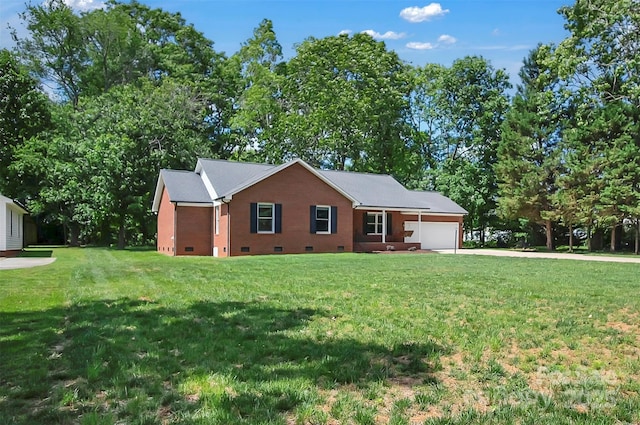 ranch-style home with crawl space, an attached garage, driveway, and a front yard