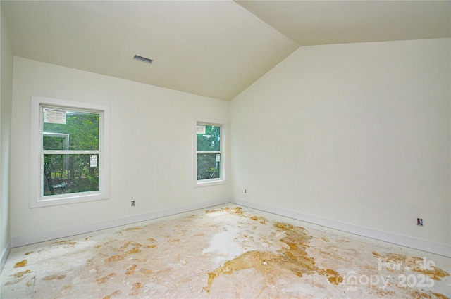 2706 Lyla Ave, Concord, NC 28027 - empty room with plenty of natural light and vaulted ceiling
