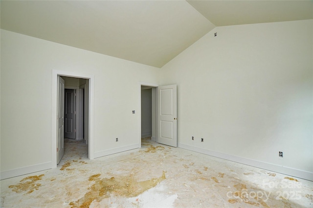 2706 Lyla Ave, Concord, NC 28027 - unfurnished bedroom featuring baseboards and lofted ceiling